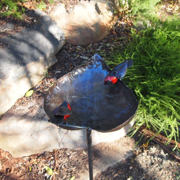 Handcrafted metal bird feeder